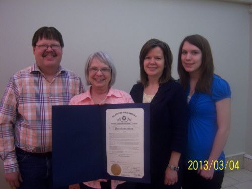 Photo of Baker family with Oklahoma proclamation